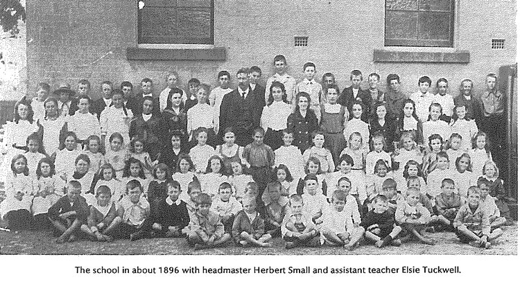 A grainy old photo of the students and staff at SPS in 1896